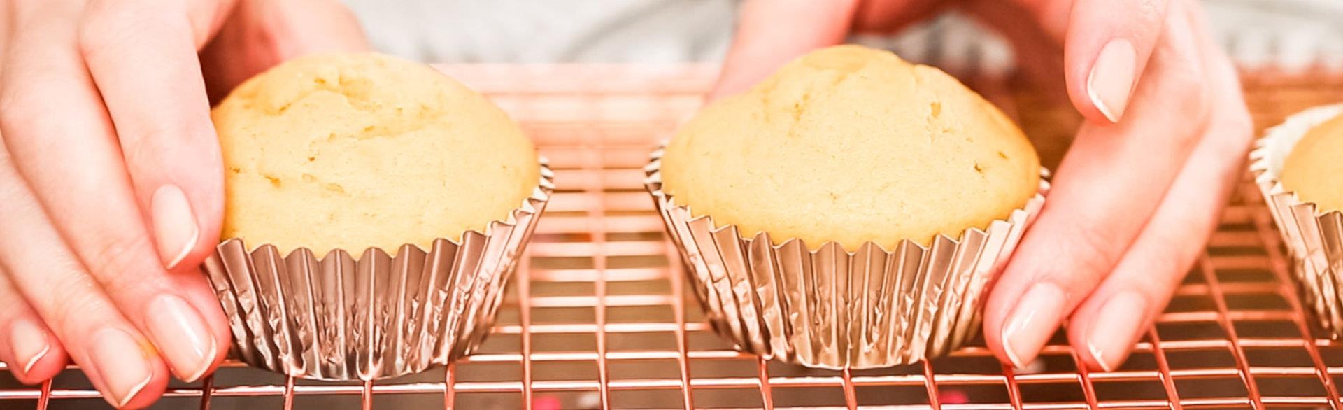 Hands holding cupcakes