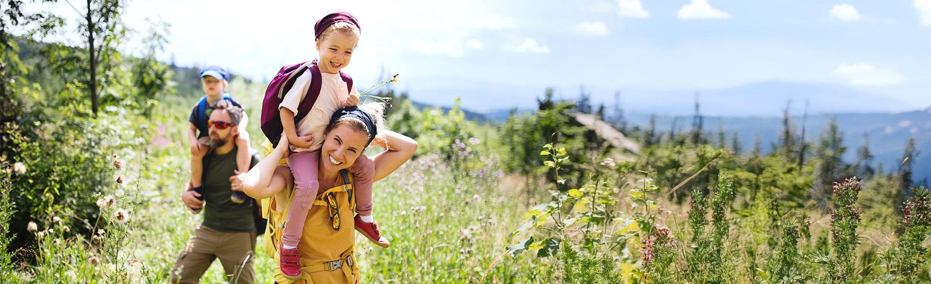 Young family hiking on a sunny day