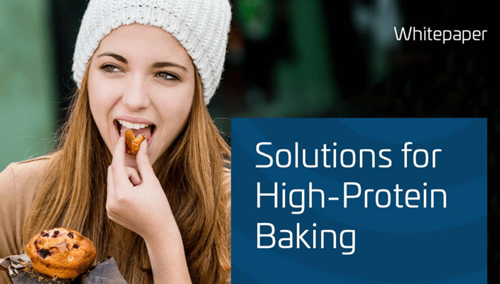 Person holding a muffin with text 'Solutions for High-Protein Baking' on a blue background