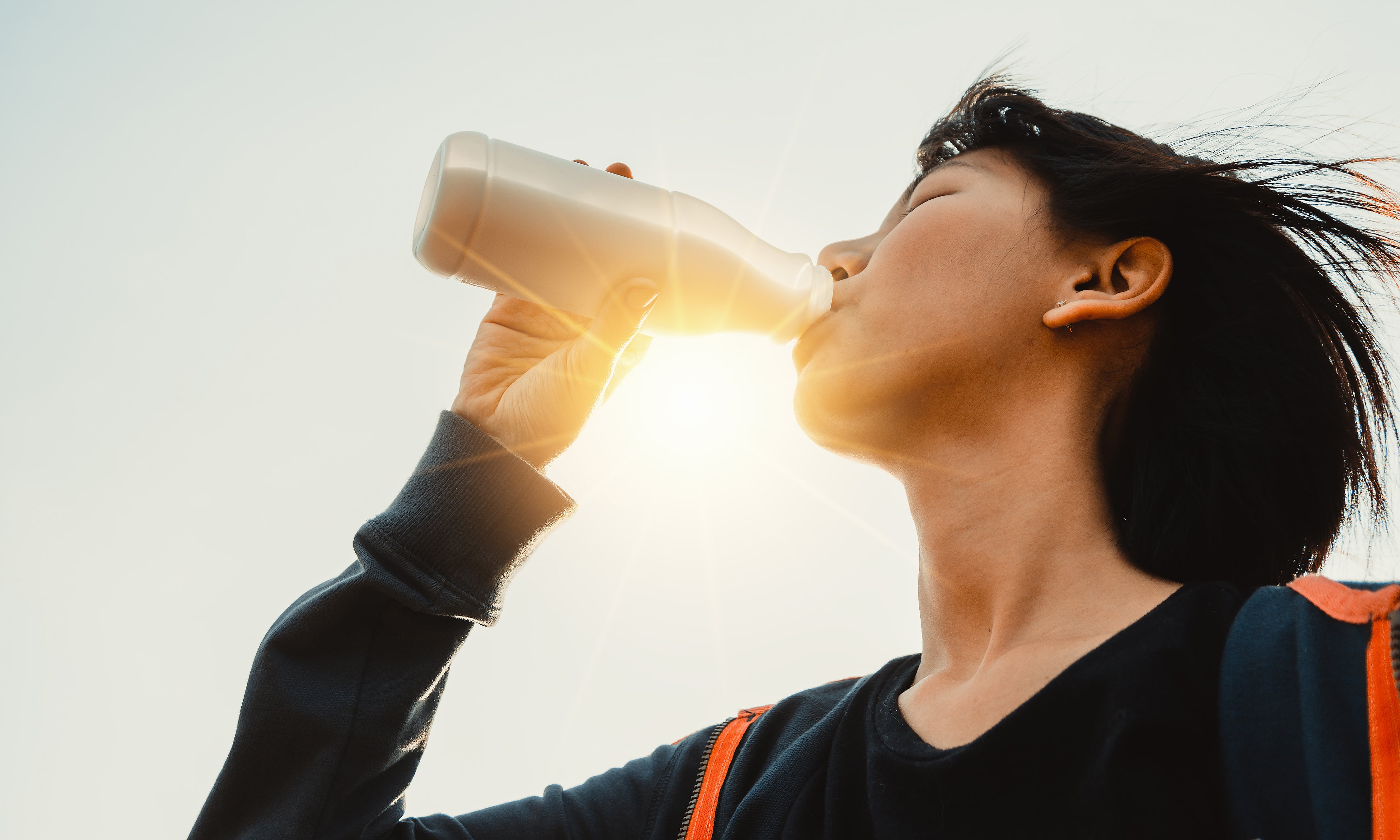 woman drinking protein drink